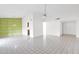 Bright and open living room with tile floors and vintage wallpaper accent wall at 6824 N 31 Ave, Phoenix, AZ 85017