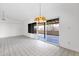 Living room with tile floors, white walls, and sliding glass doors at 6824 N 31 Ave, Phoenix, AZ 85017