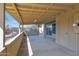 Covered patio area with beige walls, concrete floor, and concrete block barrier at 6824 N 31 Ave, Phoenix, AZ 85017