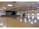 Spacious auditorium with a stage, piano, and ample open floor, ideal for events and gatherings at 7750 E Broadway Rd # 843, Mesa, AZ 85208