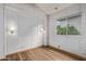 This bedroom features hard wood floors, a large window, and sconce lighting at 7750 E Broadway Rd # 843, Mesa, AZ 85208