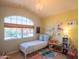 Bright bedroom with a large window and a cheerful and colorful design scheme at 7826 W Kerry Ln, Glendale, AZ 85308