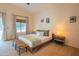 Comfortable bedroom featuring a ceiling fan, natural light, and minimalist decor at 7826 W Kerry Ln, Glendale, AZ 85308