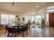 A dining room with travertine floors, high ceilings, and abundant natural light at 7826 W Kerry Ln, Glendale, AZ 85308