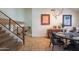 The dining room offers great lighting, a unique stairway and travertine flooring at 7826 W Kerry Ln, Glendale, AZ 85308