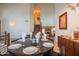 Elegant dining room with travertine floors and access to living area and staircase at 7826 W Kerry Ln, Glendale, AZ 85308