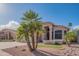 Beautiful home exterior with lush landscaping, palm trees, and a well-maintained lawn, creating inviting curb appeal at 7826 W Kerry Ln, Glendale, AZ 85308