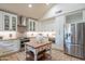 Beautiful kitchen with white cabinetry, granite countertops and stainless steel appliances at 7826 W Kerry Ln, Glendale, AZ 85308