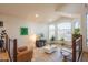 Comfortable living area featuring large windows, travertine flooring, and modern decor at 7826 W Kerry Ln, Glendale, AZ 85308