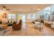 Bright living room with tile floors and large windows that let in plenty of natural light, and a glimpse to the pool at 7826 W Kerry Ln, Glendale, AZ 85308