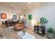 A warm inviting living space featuring travertine floors and lots of natural light at 7826 W Kerry Ln, Glendale, AZ 85308