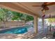 A gorgeous pool is the centerpiece of the patio, offering a tranquil escape, and trees at 7826 W Kerry Ln, Glendale, AZ 85308