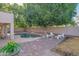 Backyard pool area with paved patio, lush greenery, and ample space for seating at 7826 W Kerry Ln, Glendale, AZ 85308