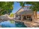 Stunning backyard showcases a pristine pool, covered patio, and balcony, perfect for outdoor entertaining and enjoying the Arizona sunshine at 7826 W Kerry Ln, Glendale, AZ 85308