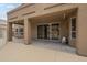 Covered back patio with large sliding glass doors, offering a seamless indoor-outdoor living experience at 908 E Mountain Sage Dr, Phoenix, AZ 85048