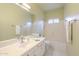 Bathroom featuring tile flooring, a single vanity, and a shower-tub combo at 908 E Mountain Sage Dr, Phoenix, AZ 85048