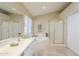 Bright bathroom boasts a soaking tub, separate glass shower, and tile floors at 908 E Mountain Sage Dr, Phoenix, AZ 85048