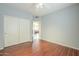 Bedroom featuring wood floors and a closet with sliding doors at 908 E Mountain Sage Dr, Phoenix, AZ 85048