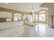 Bright kitchen with white cabinets, granite countertops, and a center island at 908 E Mountain Sage Dr, Phoenix, AZ 85048