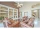 Beautiful living room with built-in shelving, hardwood floors, and comfortable seating at 908 E Mountain Sage Dr, Phoenix, AZ 85048