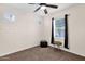 Cozy bedroom featuring a ceiling fan and neutral carpeting at 913 E Tekoa Ave, Gilbert, AZ 85298