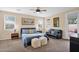 Bright bedroom with carpet, ceiling fan, and lots of natural light from multiple windows at 913 E Tekoa Ave, Gilbert, AZ 85298