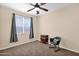 Comfortable bedroom with ceiling fan and window at 913 E Tekoa Ave, Gilbert, AZ 85298