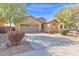 Beautiful single-story home featuring desert landscaping, mature trees, and a long driveway at 913 E Tekoa Ave, Gilbert, AZ 85298