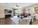 Comfortable living room featuring hardwood floors and a sliding door to the backyard at 913 E Tekoa Ave, Gilbert, AZ 85298