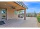 Covered patio with brick pavers, fan, and hot tub offers a relaxing outdoor space at 913 E Tekoa Ave, Gilbert, AZ 85298