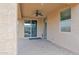 Relaxing covered patio with brick flooring, ceiling fan and access to the backyard at 913 E Tekoa Ave, Gilbert, AZ 85298