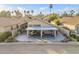 Inviting aerial view of the home's backyard, showcasing the covered patio, and manicured desert landscaping at 9409 W Taro Ln, Peoria, AZ 85382