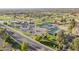 Aerial view of community amenities, including a golf course, tennis courts, and parking at 9409 W Taro Ln, Peoria, AZ 85382