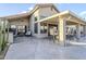 Spacious back patio with an outdoor kitchen, bar, seating and a covered dining area, perfect for entertaining at 9409 W Taro Ln, Peoria, AZ 85382