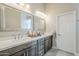 Bright bathroom featuring double sinks, modern fixtures, and a clean, contemporary design at 9409 W Taro Ln, Peoria, AZ 85382