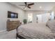 Spacious bedroom with TV, ensuite bathroom, and walk-in closet at 9409 W Taro Ln, Peoria, AZ 85382