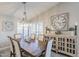 Dining room area with a wood table and a decorative clock on the wall at 9409 W Taro Ln, Peoria, AZ 85382