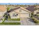 Charming home featuring a well-manicured lawn, tile roof, and attached two-car garage at 9409 W Taro Ln, Peoria, AZ 85382