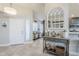 Bright foyer featuring tile floors, a decorative table, and open access to the living spaces at 9409 W Taro Ln, Peoria, AZ 85382