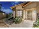 Inviting front entrance with desert landscaping, a security door, and a welcoming ambiance in Arizona at 9409 W Taro Ln, Peoria, AZ 85382