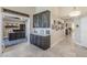 Hallway featuring storage and unique decorations leading to an office at 9409 W Taro Ln, Peoria, AZ 85382