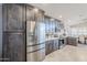 Bright kitchen featuring gray cabinets, stainless appliances, and white quartz counters at 9409 W Taro Ln, Peoria, AZ 85382