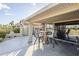 Charming covered patio with stylish seating area, grill, perfect for outdoor entertaining and relaxation at 9409 W Taro Ln, Peoria, AZ 85382