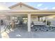 Inviting covered patio with stylish seating and dining area, perfect for outdoor entertaining and relaxation at 9409 W Taro Ln, Peoria, AZ 85382