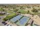 Aerial view of community tennis courts, golf course, and surrounding neighborhood in Arizona at 9409 W Taro Ln, Peoria, AZ 85382