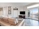 Well-lit living room featuring modern furnishings, dark floors, and a sliding glass door to balcony at 945 E Playa Del Norte Dr # 5023, Tempe, AZ 85288