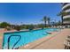 Resort-style swimming pool with clear blue water, palm trees, and a relaxing atmosphere at 945 E Playa Del Norte Dr # 5023, Tempe, AZ 85288