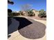 Backyard featuring decorative gravel, brick edging, and desert landscaping elements at 9632 W Runion Dr, Peoria, AZ 85382