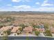 Aerial view of homes with desert landscaping, backyard pools and an expansive desert landscape beyond at 9686 W Keyser Dr, Peoria, AZ 85383