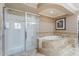 Gorgeous bathroom offering a luxurious soaking tub and spacious glass shower at 9686 W Keyser Dr, Peoria, AZ 85383